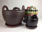 photograph of 3 ceramic pots of various shapes