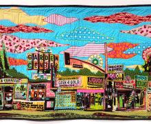 multi-colored quilt depicting a city scape
