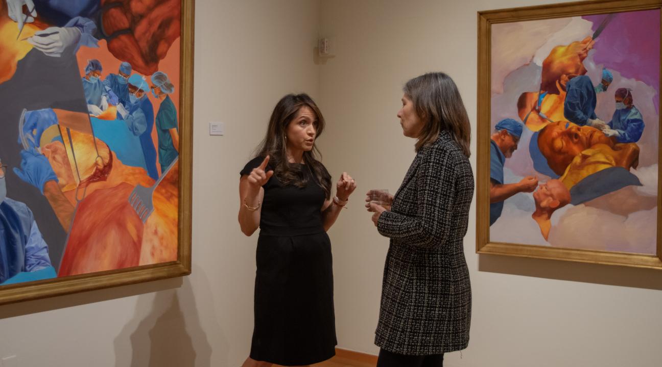 People speaking in gallery