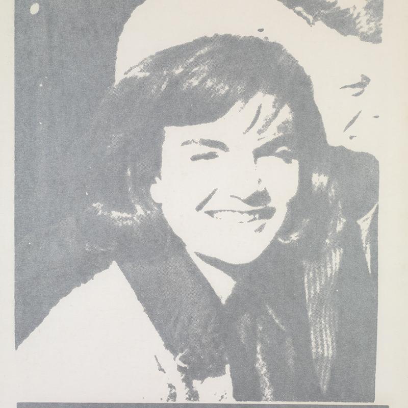 Silkscreen portrait in gray tones showing a smiling woman wearing a hat and coat, rendered in a simplified, high-contrast style. The image has a flat, graphic quality typical of Andy Warhol’s pop art portraits, emphasizing celebrity imagery and mass reproduction