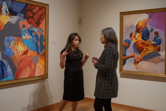 People speaking in gallery