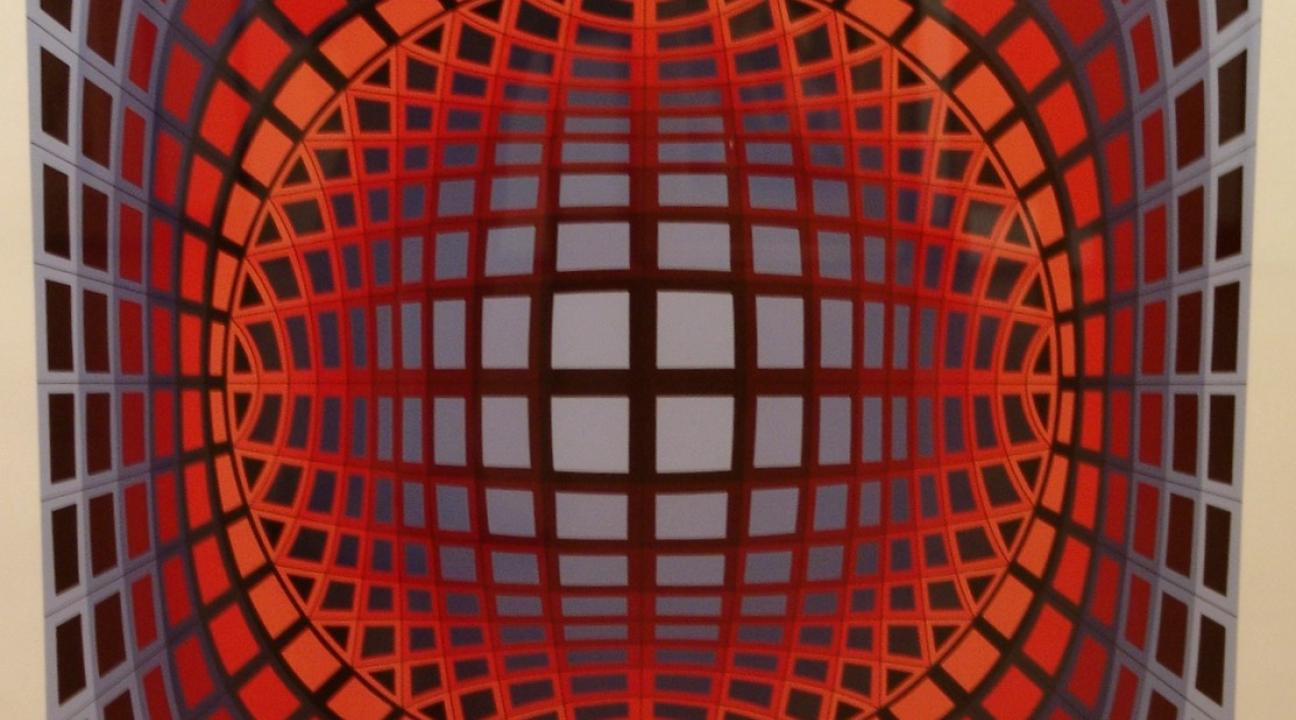 Optical art painting featuring a grid of red, orange, and purple squares that curve inward toward the center, creating the illusion of a spherical form receding into space. The geometric pattern produces a dynamic sense of depth and movement, characteristic of Victor Vasarely’s op art style